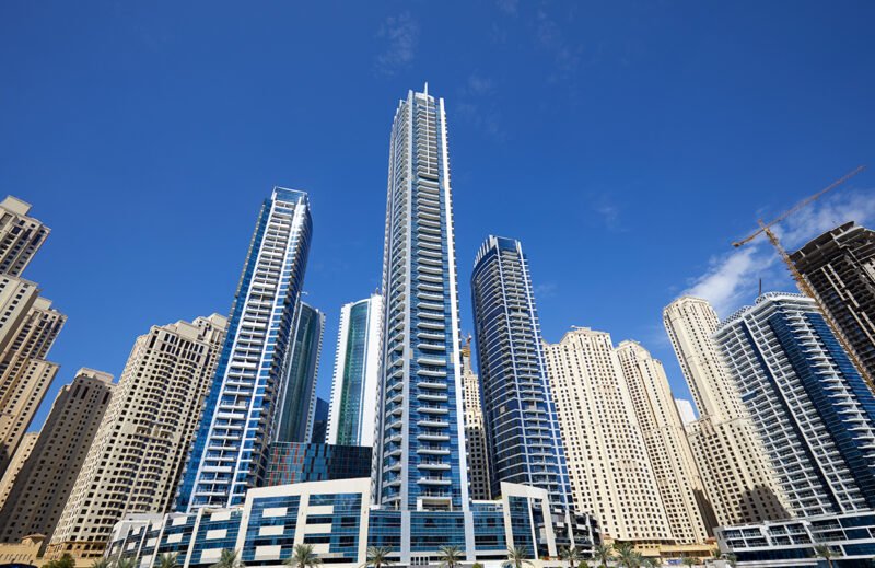 Dubai Marina new and under construction skyscrapers in a sunny d