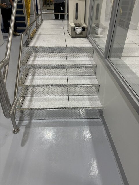 Access floor stair with stainless steel handrails at Photonics, Vancouver
